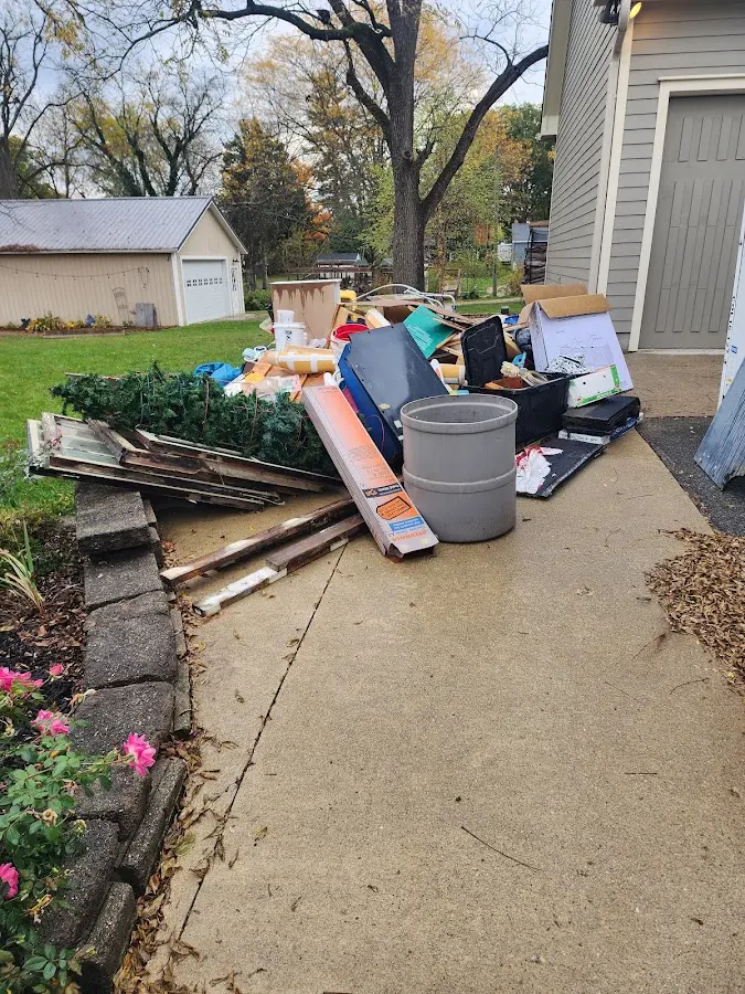 Dumpster being loaded with debris for 3 Yard Dumpster Rental in Catalina Foothills